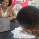 Wildflower's Hloni Mkhonza interacts with women eager to qualify as professional carers